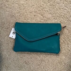 Adorable, turquoise blue convertible, clutch to cross body with hidden pocket
